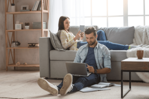 Couple in living room enjoying home comfort