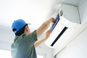 technician completing ductless mini-split maintenance