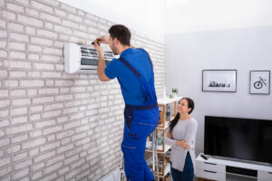 technician completing ductless mini-split repair