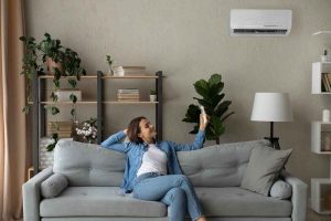 woman operating ductless hvac system