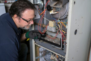 HVAC contractor inspecting a system