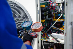 HVAC technician servicing a system